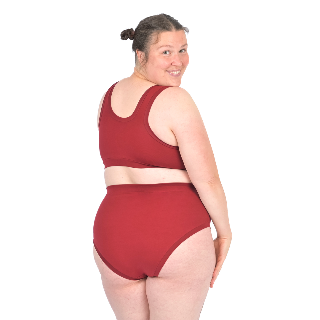 Katy wearing a burgundy pull on non wired bra and high rise cotton briefs